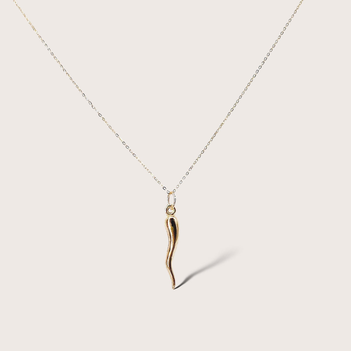14K solid gold Italian horn necklace with puffed cornicello pendant, close-up product view