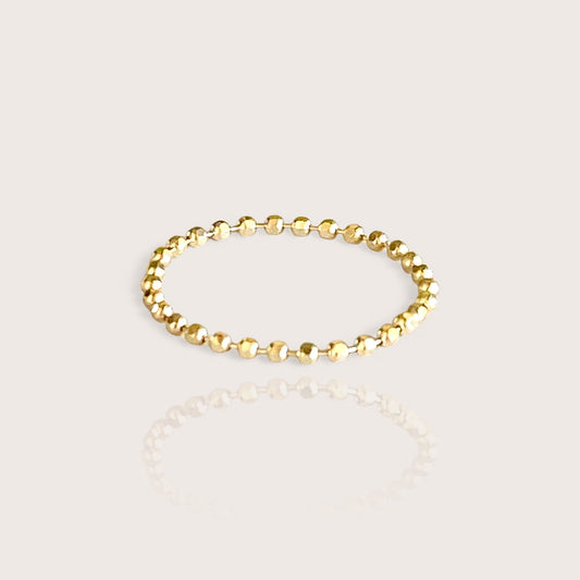 A 14K gold bead chain ring with a diamond-cut finish, providing a shiny and sparkling appearance.