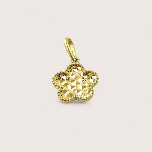 Close up of Solid 14k Gold Clover Pendant with Diamond Cut pattern on front side