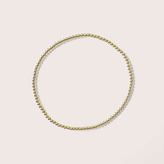 Dainty 2mm Gold Beaded Bracelets, handcrafted with premium 14K yellow gold-filled beads that are water-resistant and tarnish-proof, effortlessly add sophistication to any outfit. Ideal for stacking and layering, these bracelets are the ultimate choice for chic accessorizing.