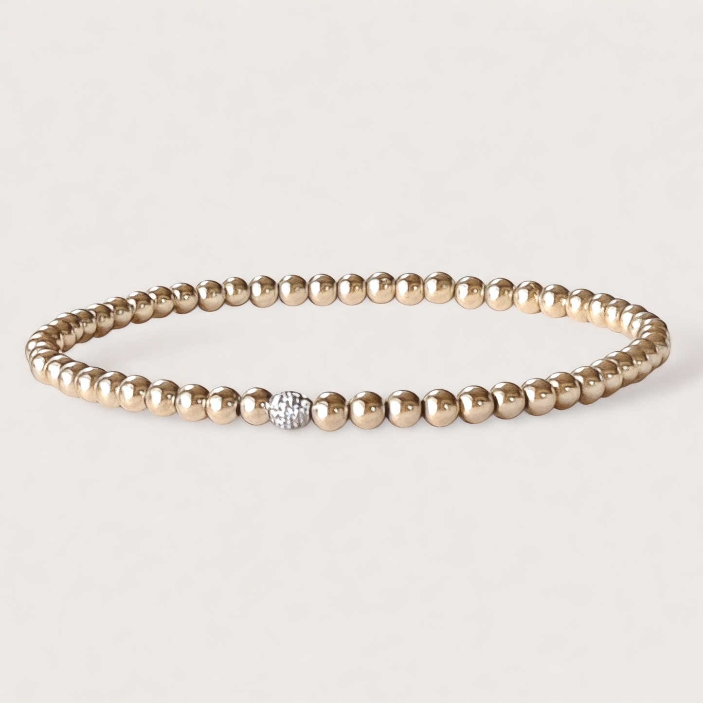 Close-up of real diamond ball accent bead in 14K gold beaded bracelet — 3mm fine jewelry by Ashley Nicole Jewelry