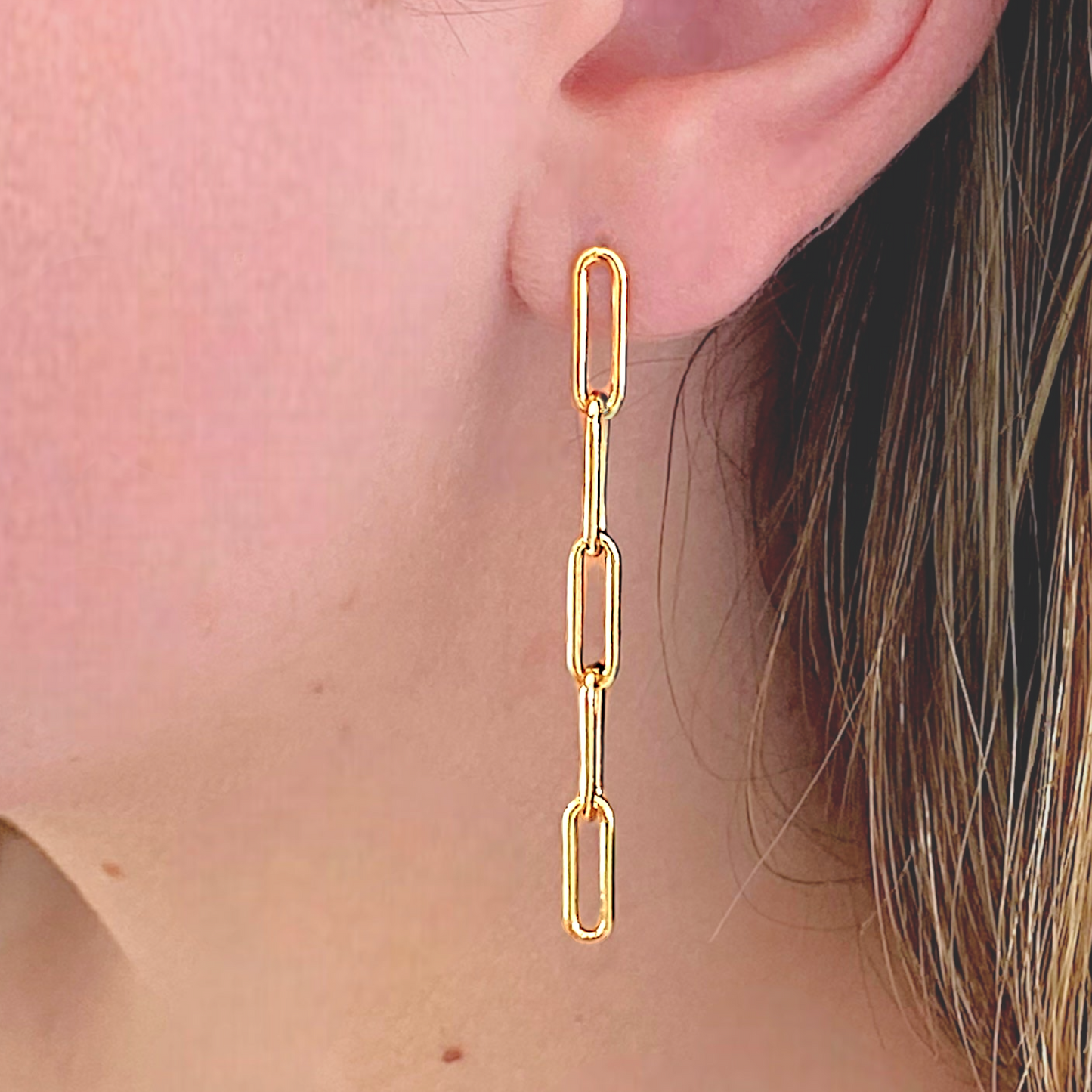 Model wearing the 5 Link Paperclip Chain Link Dangle Earrings 14k Gold Filled.