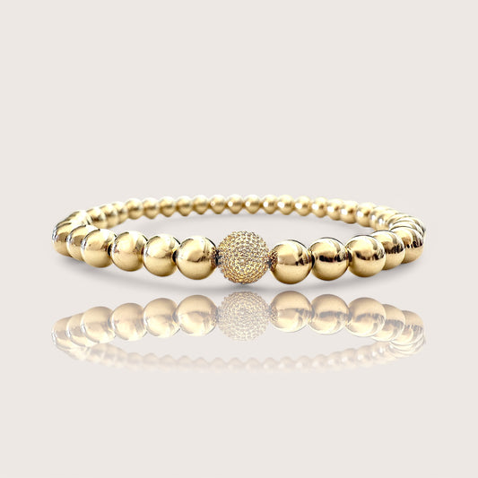 5mm 14K Yellow Gold Beaded Ball Bracelet with a Single Yellow Gold Diamond Ball. Crafted from premium 14K Gold and adorned with genuine diamond accents exuding sophistication and elegance.
