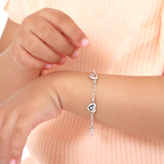 Toddler Model wearing silver heart bracelet on wrist