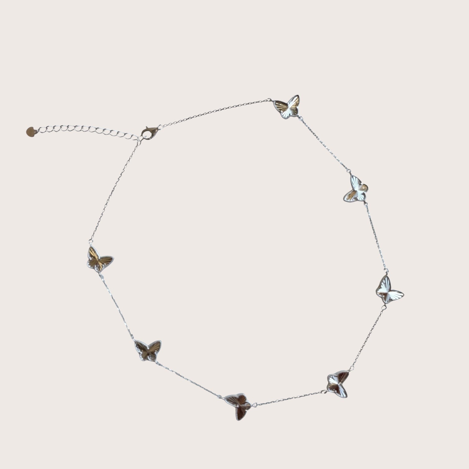 Adjustable necklace in 925 sterling silver with featuring faceted butterfly motif pendants