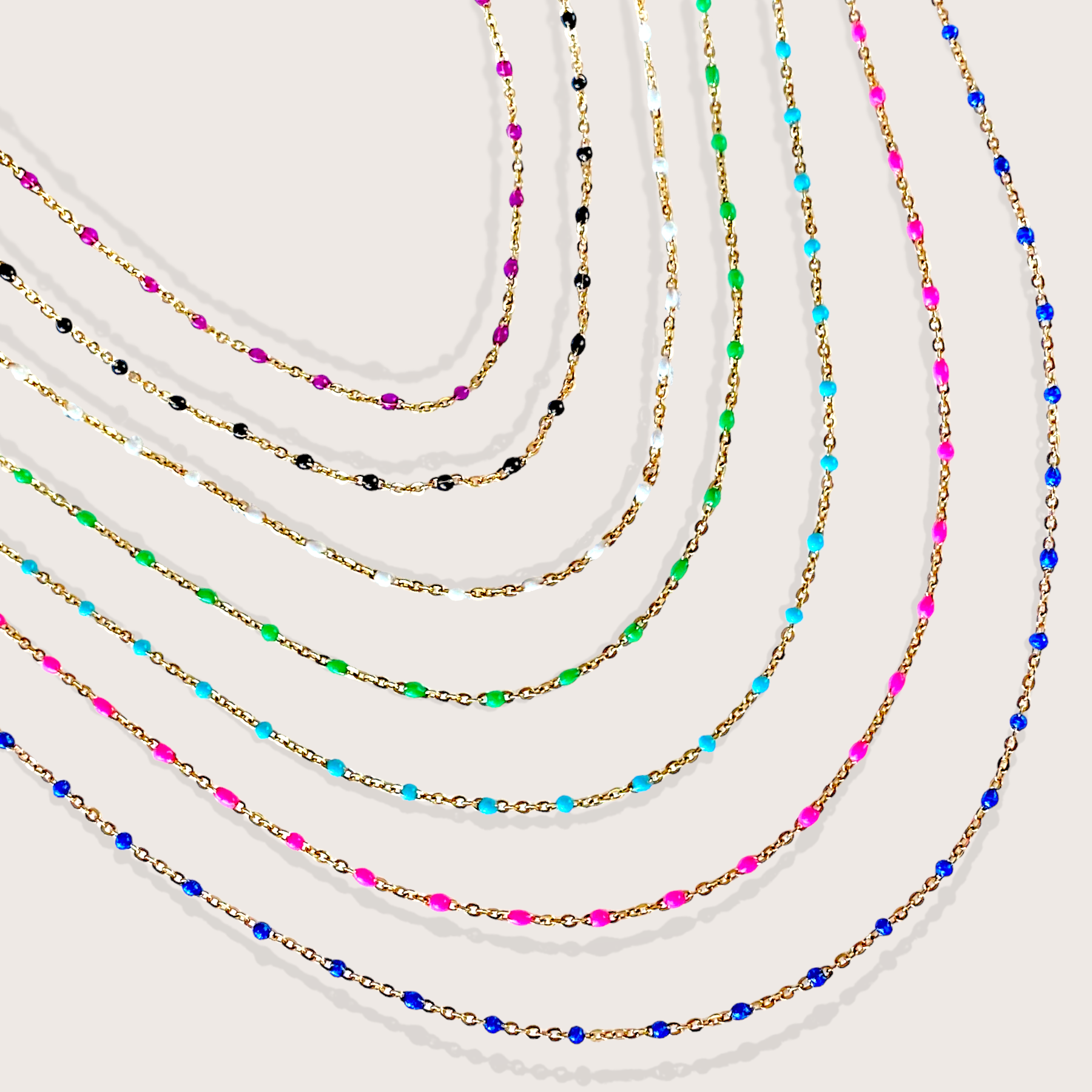 Set of colorful beaded necklaces on a white background