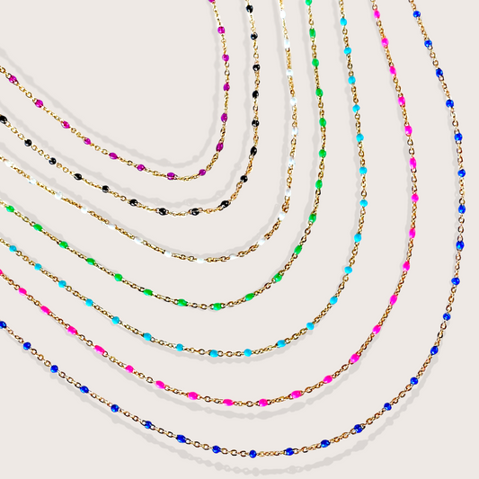 Set of colorful beaded necklaces on a white background