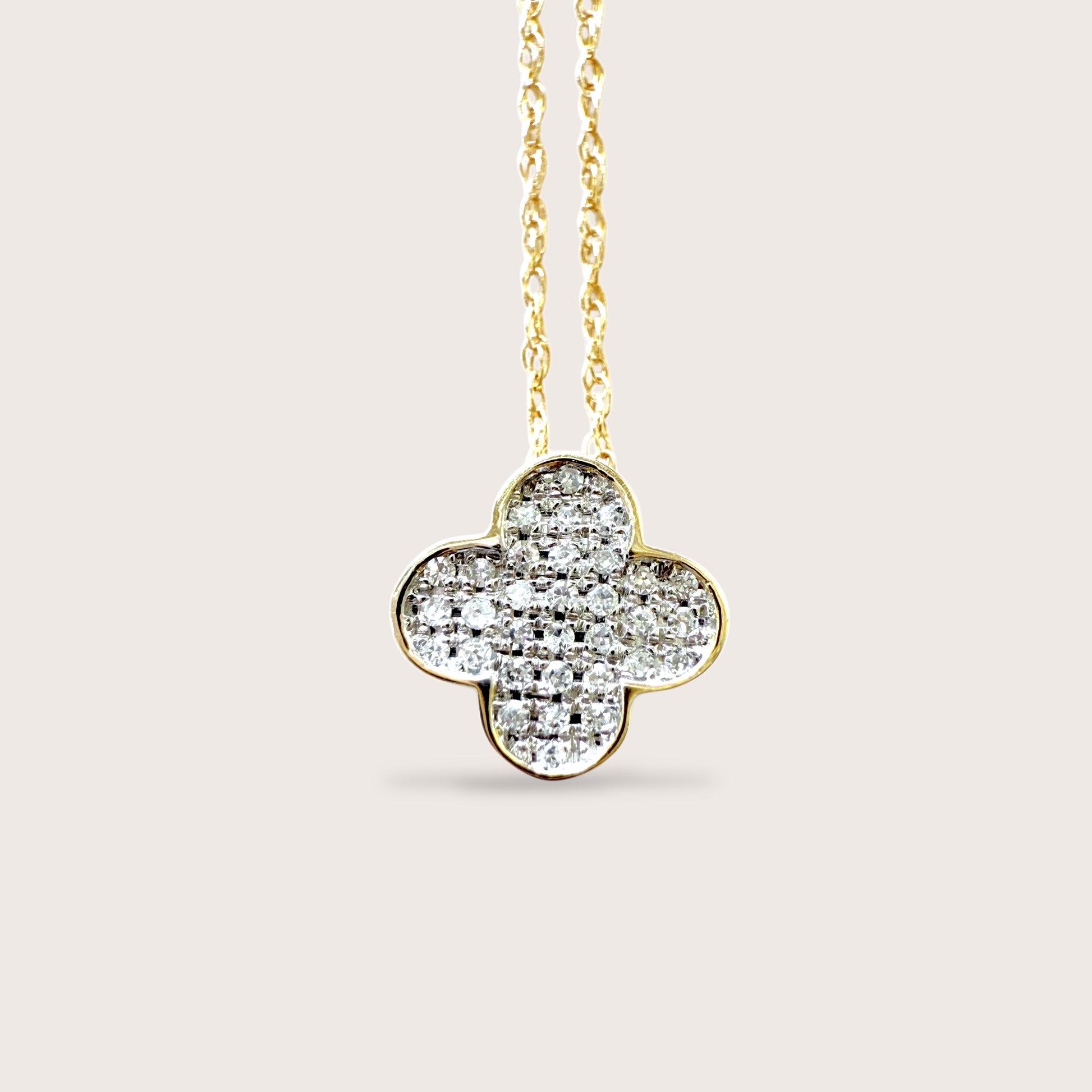 Dainty 14K Yellow Gold Necklace with a dainty Pave Diamond clover-shaped pendant on a delicate open rope chain