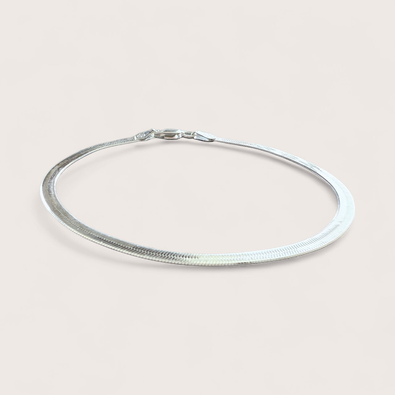 Side angle of 925 Silver Herringbone Bracelet with a lobster clasp closure
