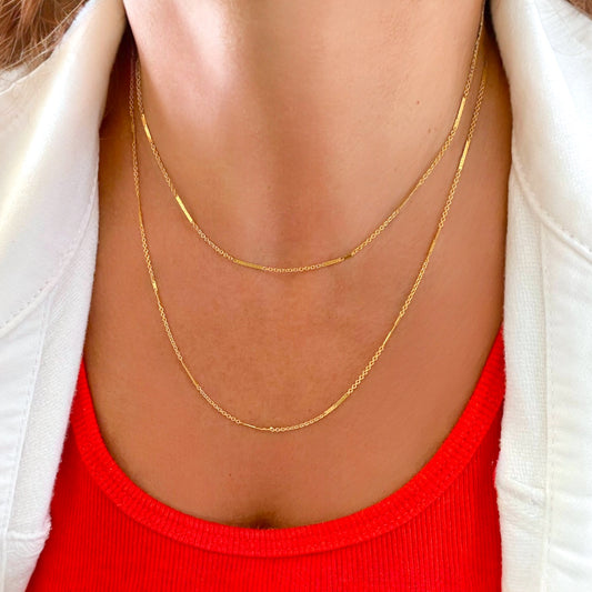 14K Gold Filled Bar Station Chain Necklace on model showing dainty dapped bar links layered