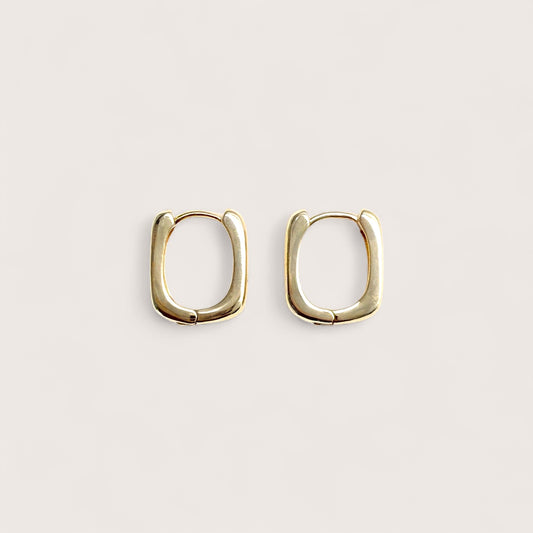 Side view for pair of gold huggie hoop earrings