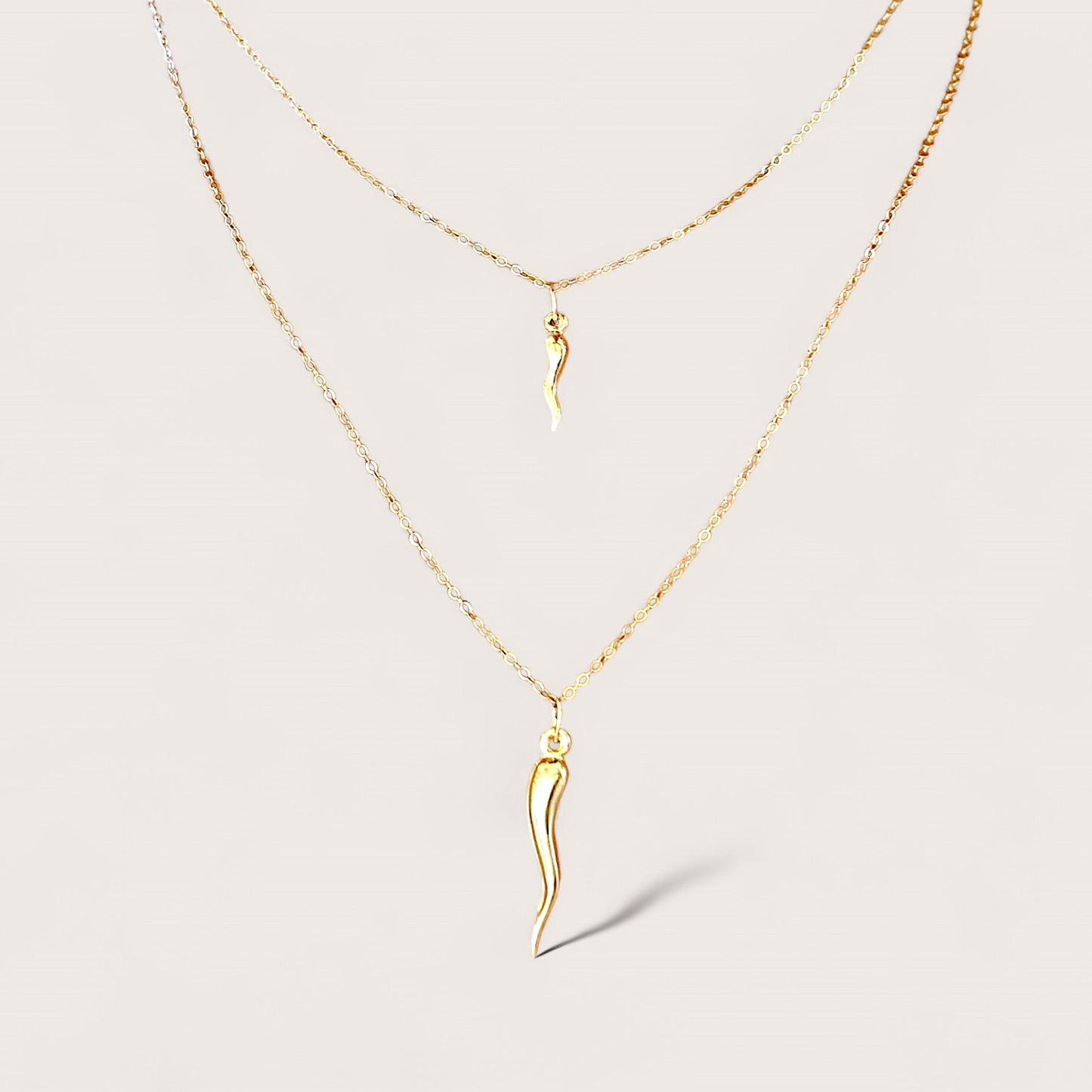 14k gold filled horn necklaces, two size horn options shown, in different necklace lengths
