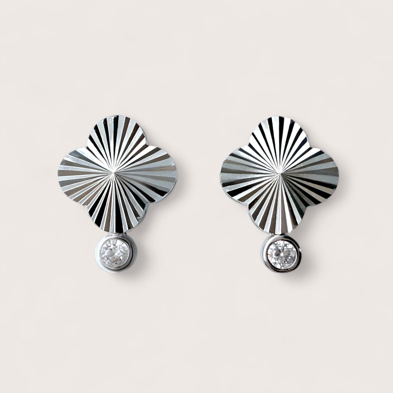 Pair of sterling silver four leaf clover stud earrings with rhodium plating