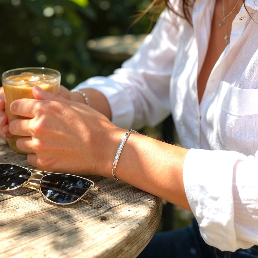 Person wearing Modern sterling silver CZ chain bracelet, gift for herSterling Silver Pave CZ Bar Link Bracelet – Rhodium Plated Elegance