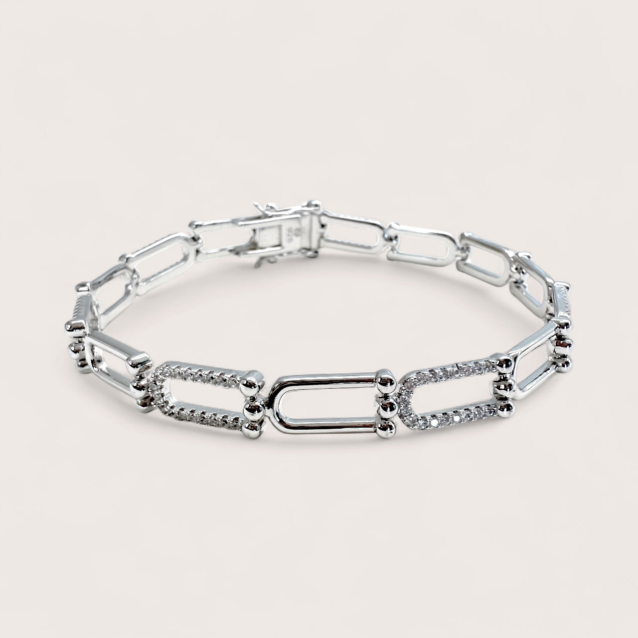 925 Sterling Silver Pave CZ U Link chain bracelet on a light gray