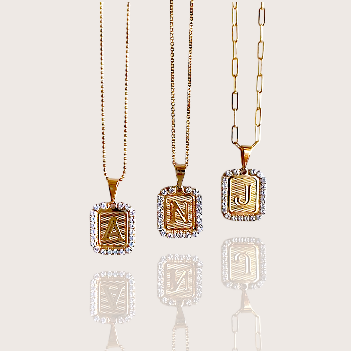 Dainty Gold CZ Initial Necklaces elegant letter charm outlined in sparkling diamond like crystals, made with high quality materials, finished in 14K yellow gold. Choose your chain for a Chic personalized initial necklace. A must-have versatile piece that can be worn for casual or formal occasions.