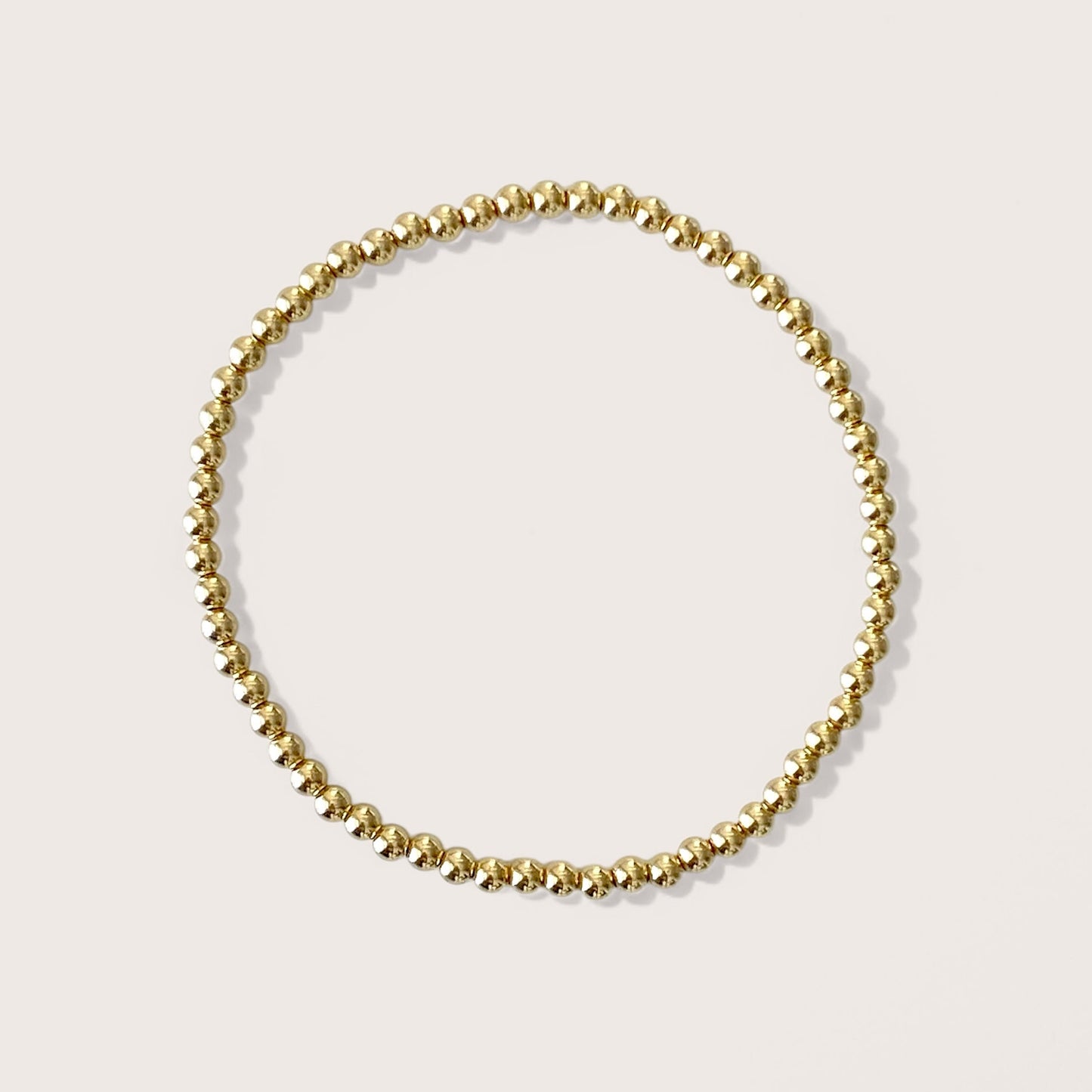 3mm Gold Beaded Bracelets, handcrafted with premium 14K yellow gold-filled beads that are water-resistant and tarnish-proof, effortlessly add sophistication to any outfit. Ideal for stacking and layering, these bracelets are the ultimate choice for chic accessorizing.