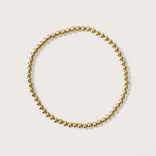 3mm Gold Beaded Bracelets, handcrafted with premium 14K yellow gold-filled beads that are water-resistant and tarnish-proof, effortlessly add sophistication to any outfit. Ideal for stacking and layering, these bracelets are the ultimate choice for chic accessorizing.