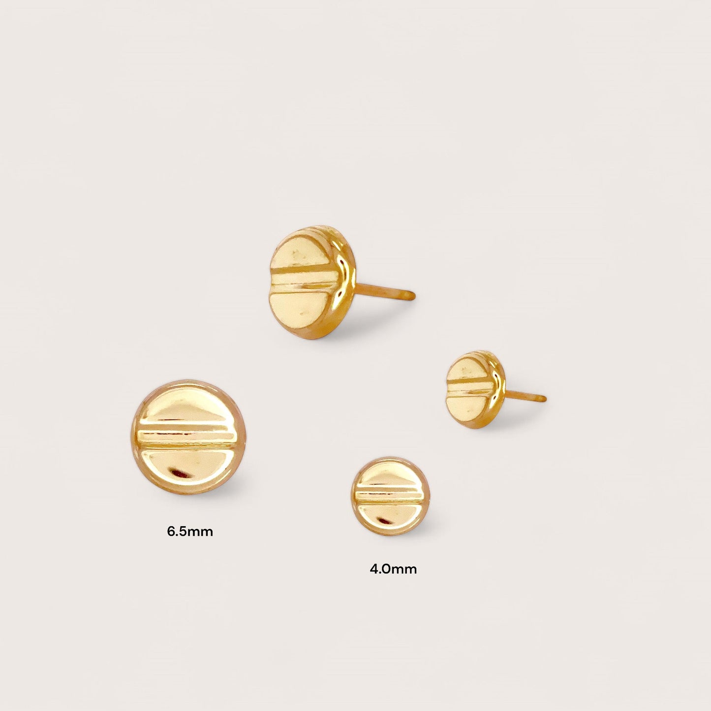 Close-Up of Love Style Gold Stud Earrings in 4mm and 6.5mm Sizes