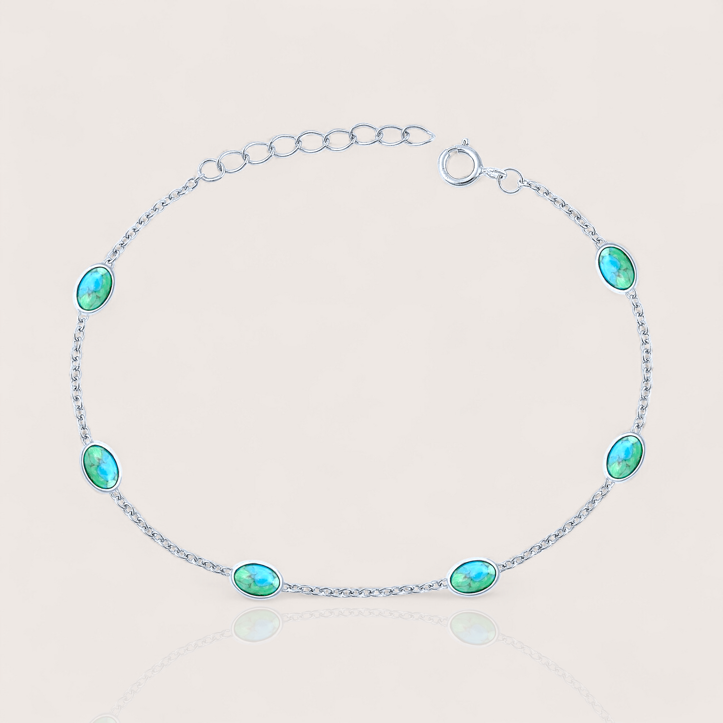 Close-up of sterling silver turquoise station bracelet with 6 oval turquoise stones