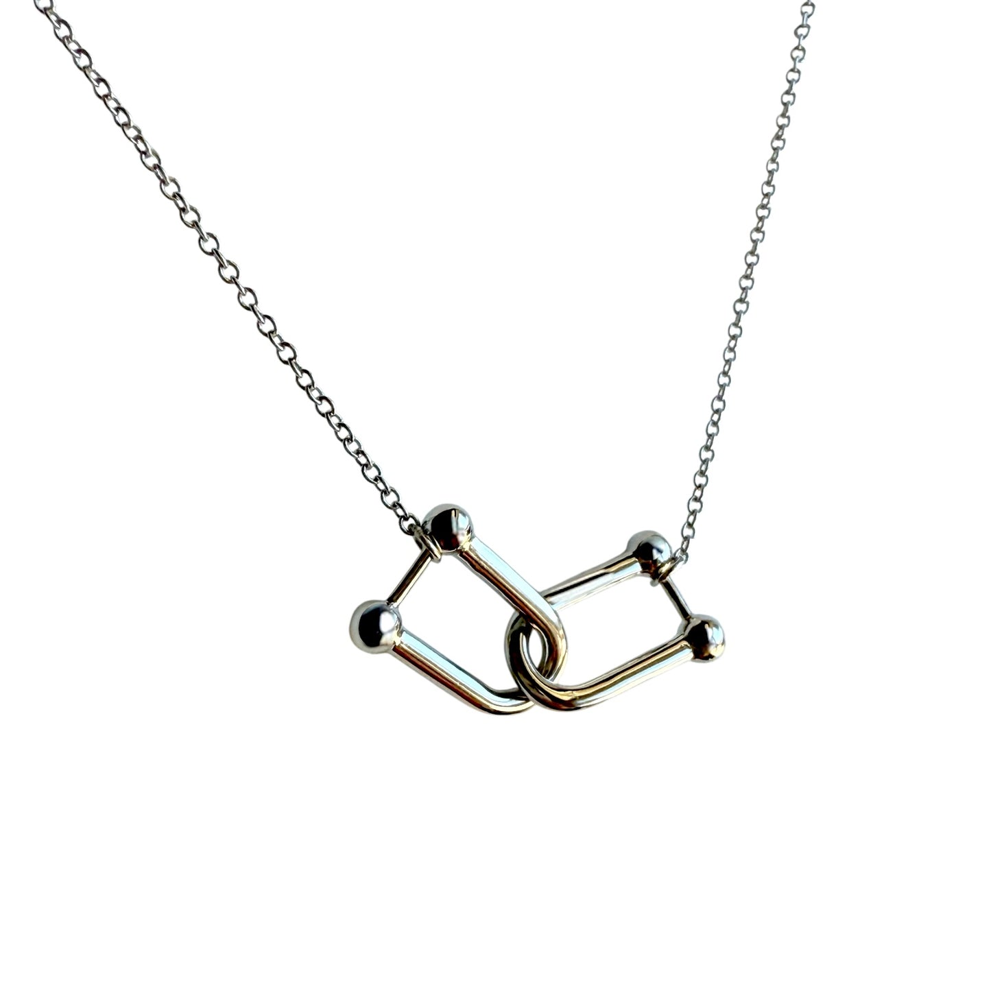 Necklace with a unique U-link shape pendant design on a white background