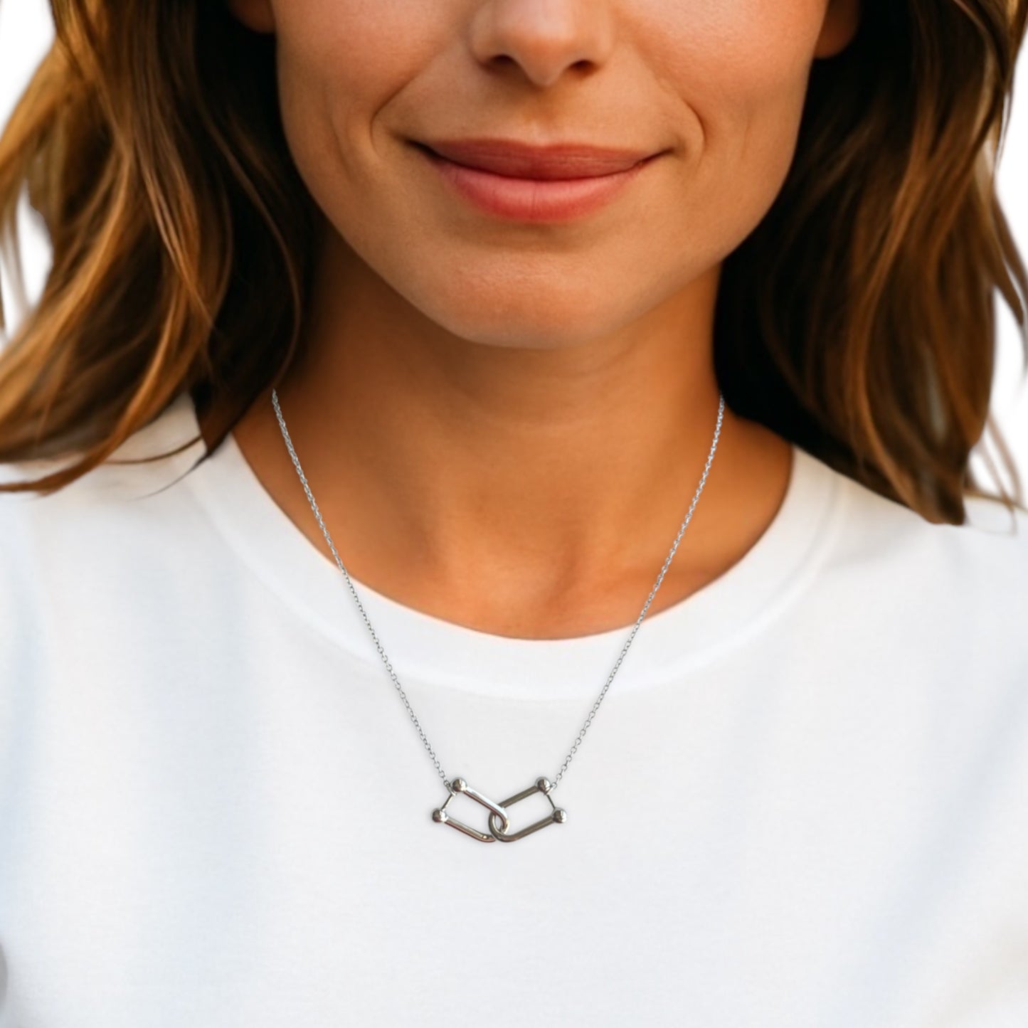 Woman wearing a silver U-Link necklace with a white background