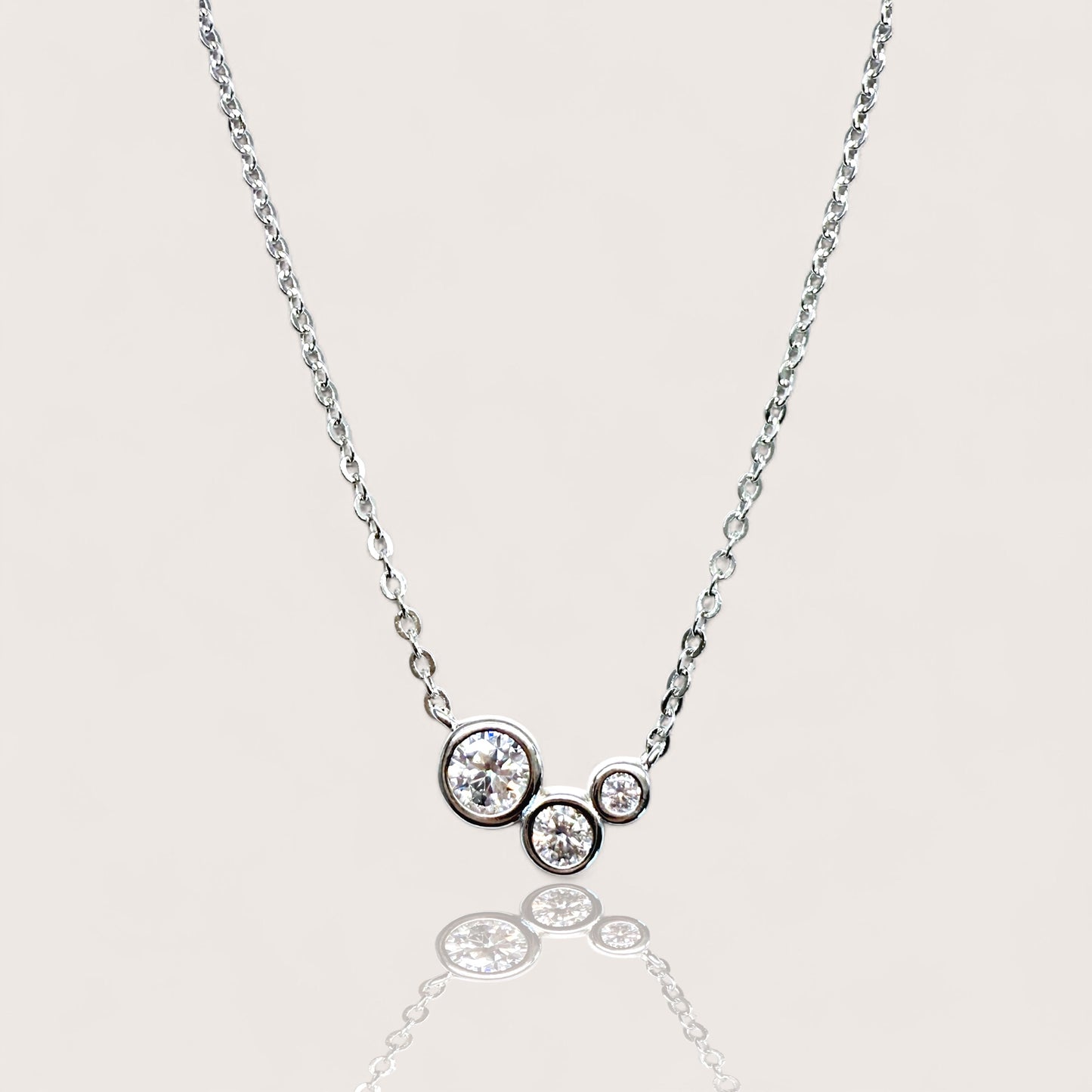 925 Sterling Silver Rhodium Plated. bezel-set round moissanite cluster pendant necklace