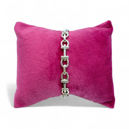 925 Silver u-link chain bracelet on a pink pillow with a white background