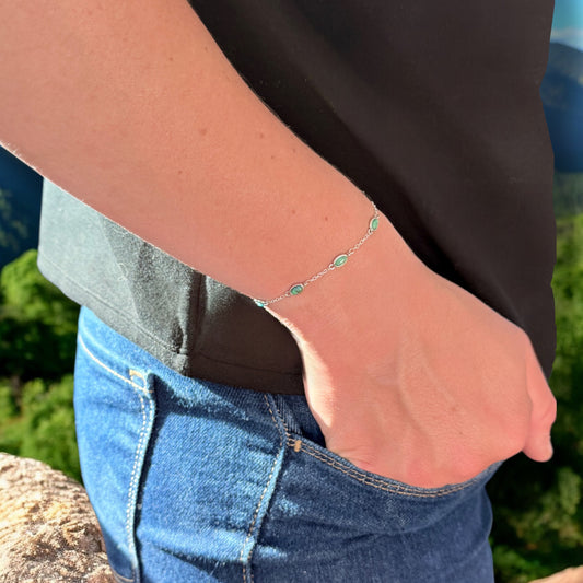 model wearing sterling silver turquoise station bracelet