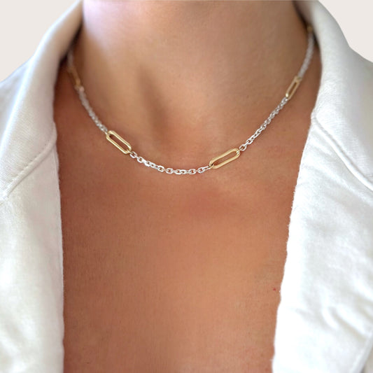 Woman wearing two-tone sterling silver and gold paperclip necklace
