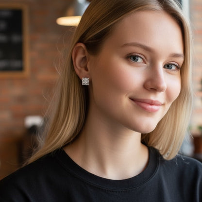 model wearing diamond huggie earrings in a casual setting