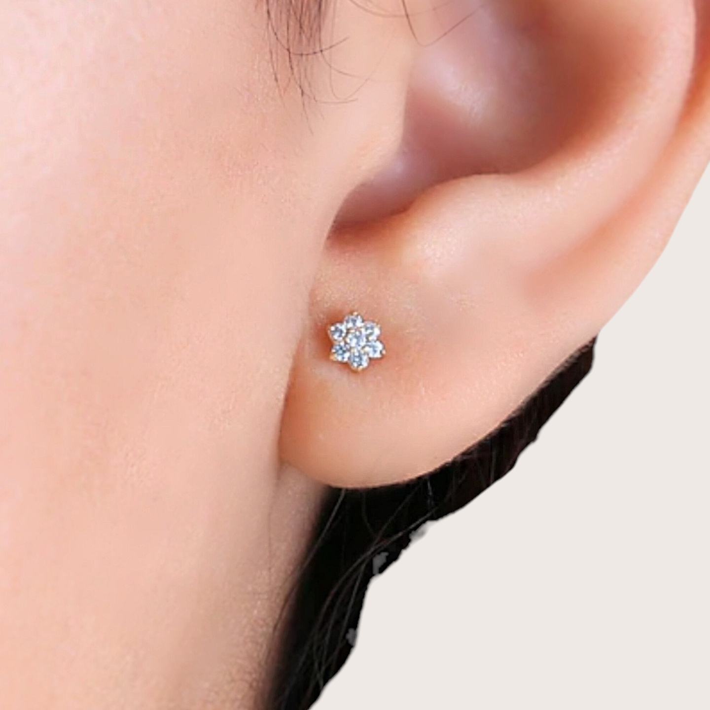 Close up of the 14K Solid Gold Diamond Flower Earrings