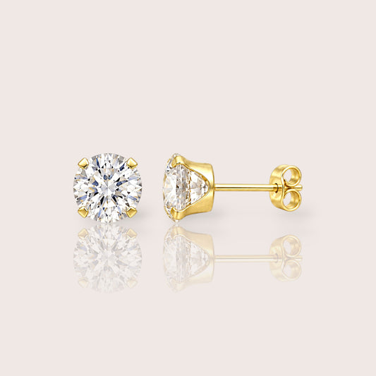 Pair of gold-filled CZ stud earrings shown from the front and side, with a butterfly back fitted onto the visible post.