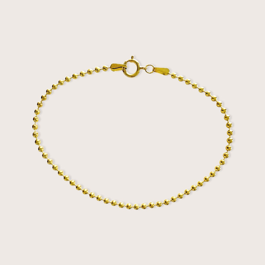 Full circular lay flat view of the 14K gold-filled 2mm ball chain bracelet on a clean neutral background.