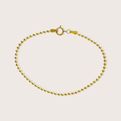 Full circular lay flat view of the 14K gold-filled 2mm ball chain bracelet on a clean neutral background.