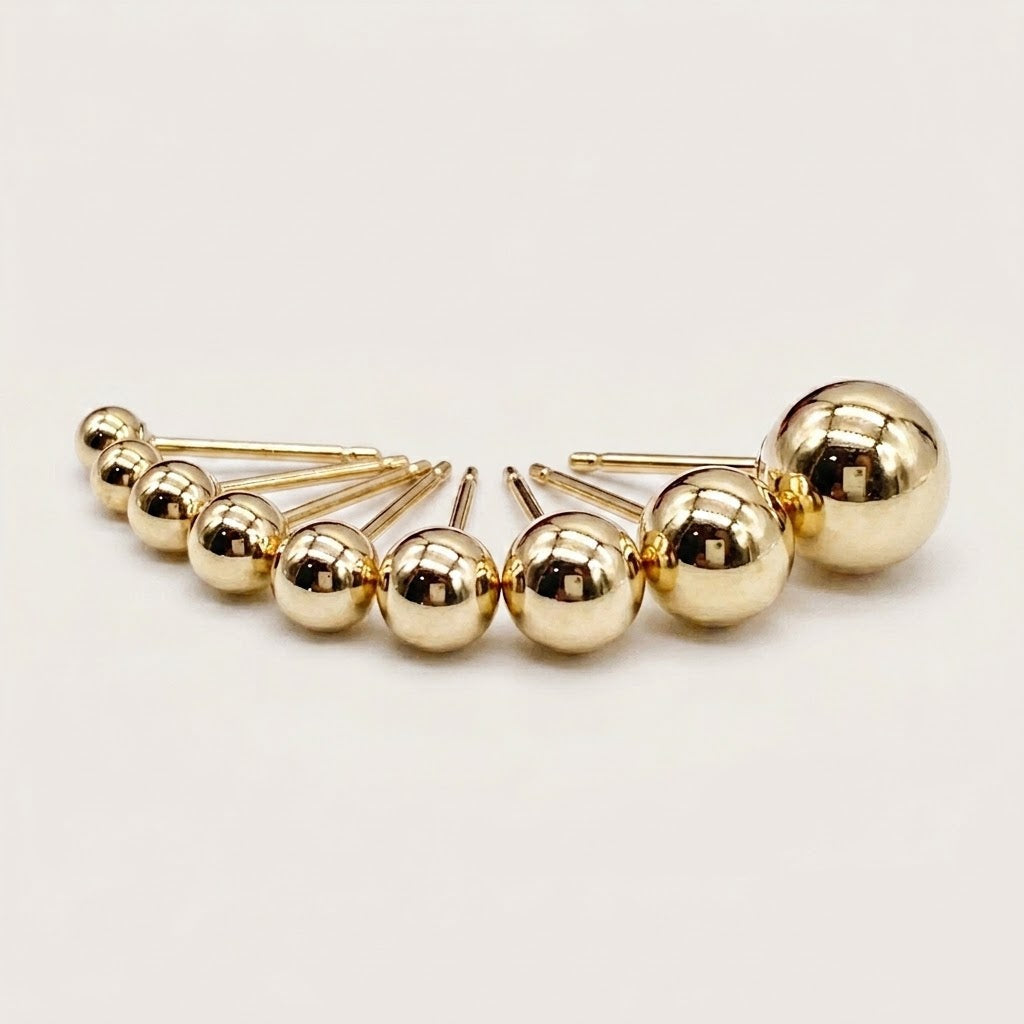 The full size range of 14K gold-filled ball stud earrings from 2mm to 8mm displayed in order on a clean white background.