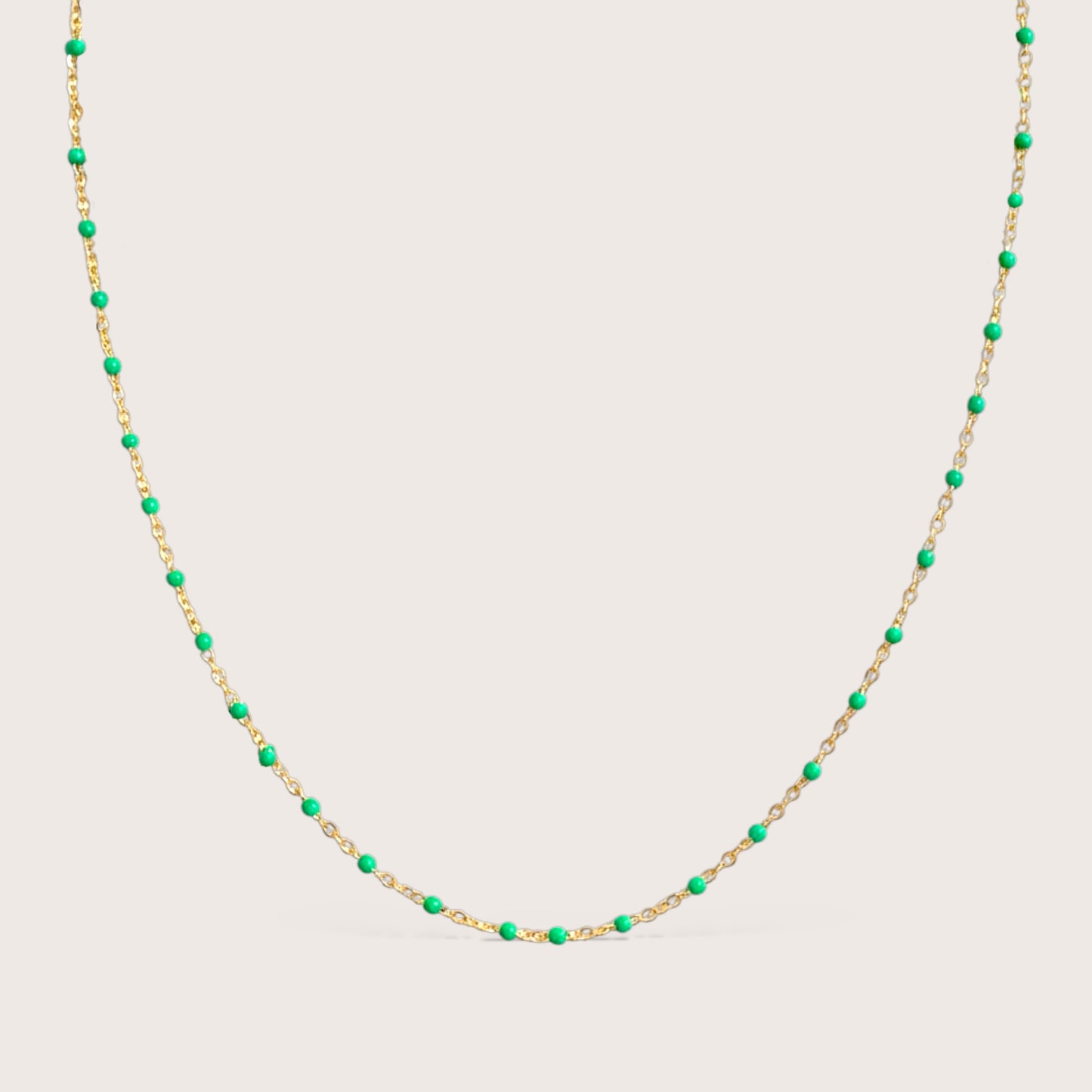 14K gold filled emerald green enamel beaded station necklace on white background