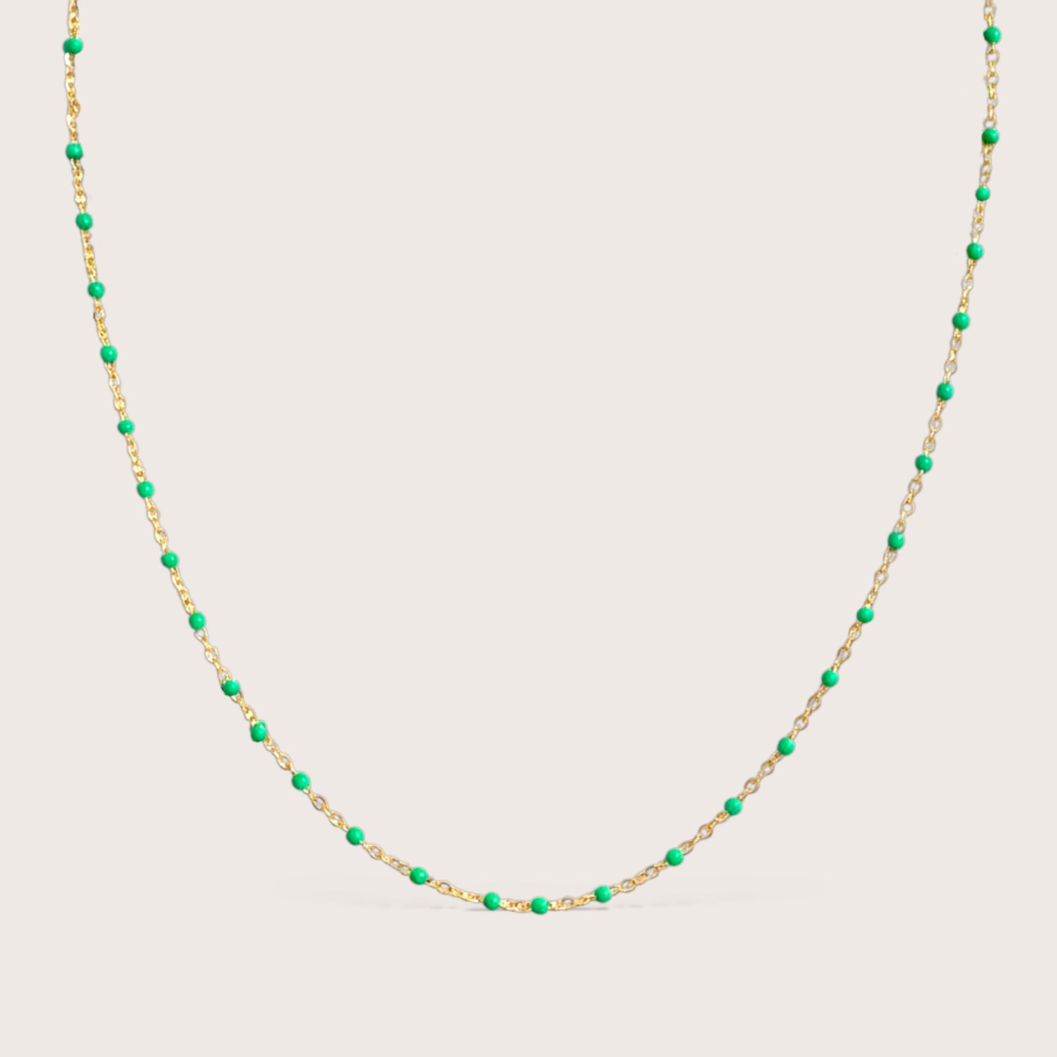 14K gold filled emerald green enamel beaded station necklace on white background