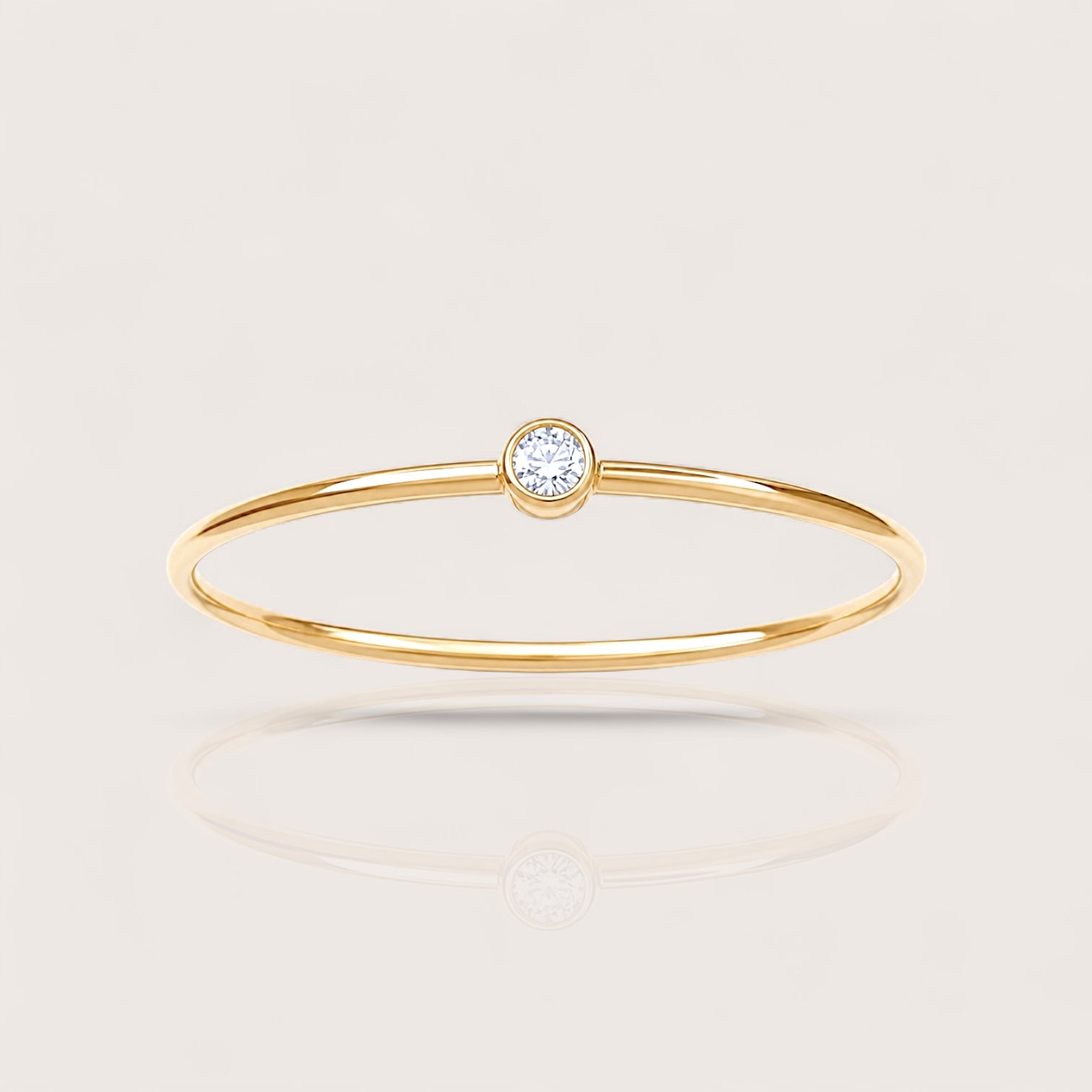Detailed close-up shot highlighting the high-polish finish and flush setting of the 14K gold filled lab diamond bezel ring