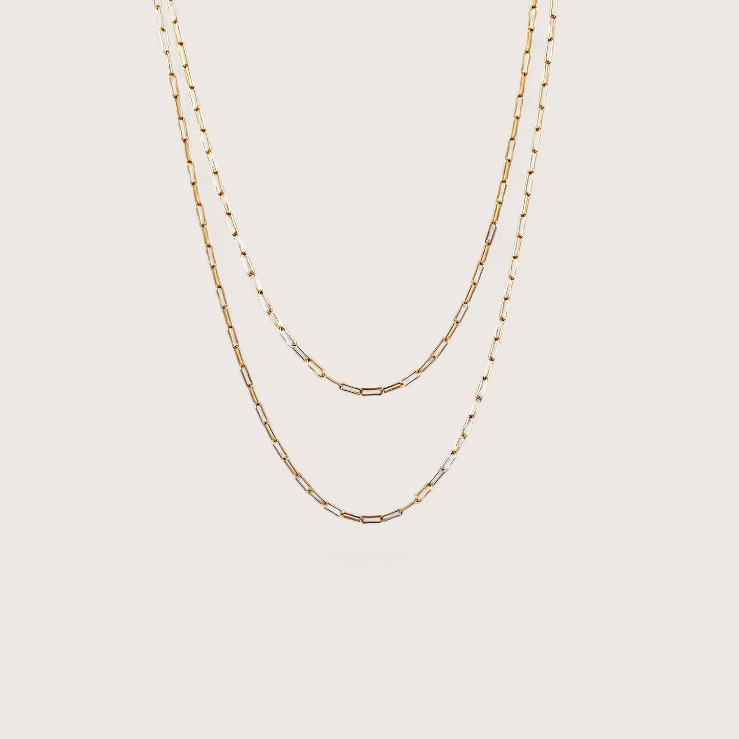 close-up flat lay of a 2.0mm 14K gold-filled flat link paperclip chain necklace with a high-polish finish by Ashley Nicole Jewelry