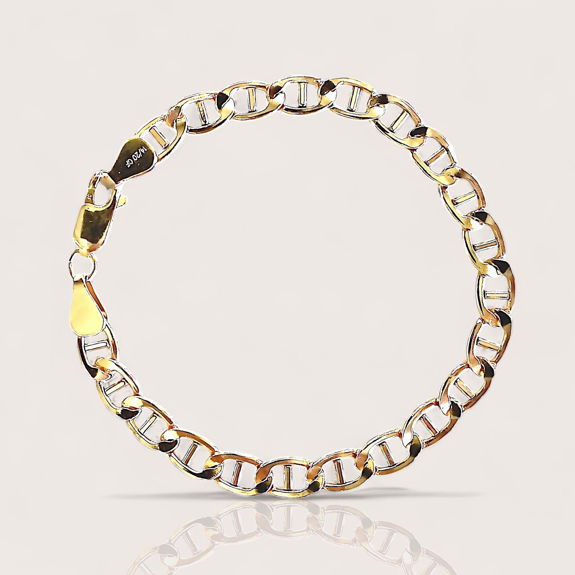 High polish 14k gold filled flat mariner anchor link chain bracelet lying flat on a minimalist surface by Ashley Nicole Jewelry⁠