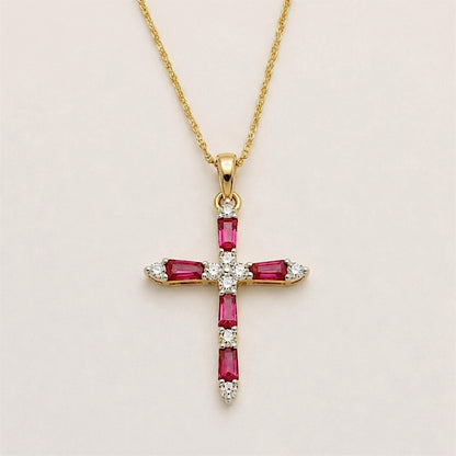 Front view of a yellow gold cross pendant with five rectangular rubies and round diamond accents