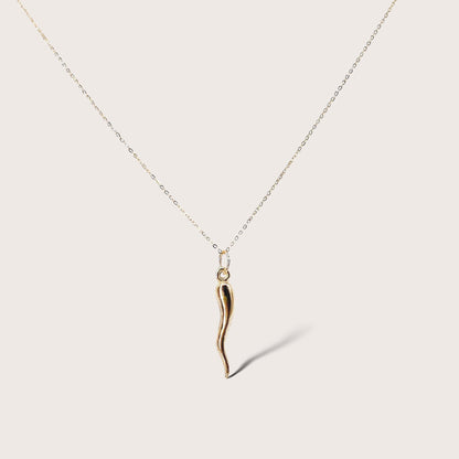 14K solid gold Italian horn necklace with puffed cornicello pendant, close-up product view