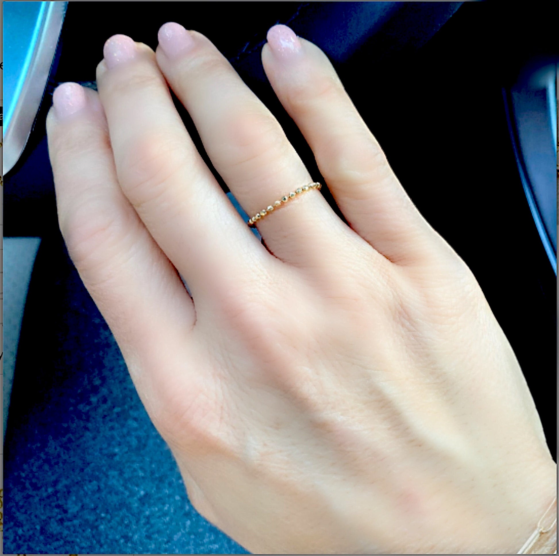 Model wearing a 14k Gold Ball Chain Ring