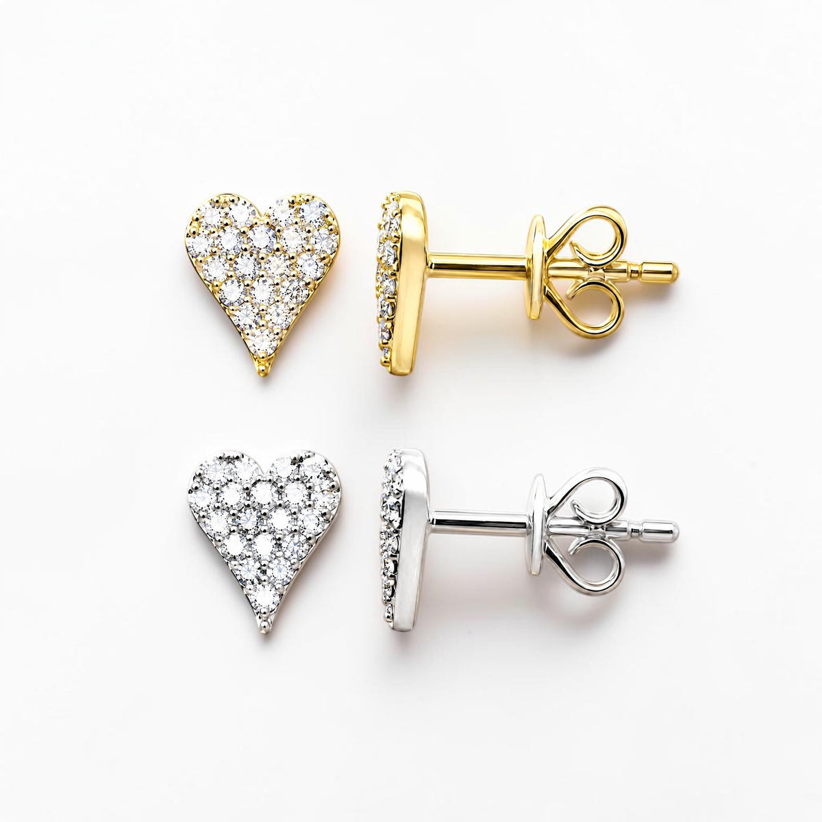 14k solid gold heart-shaped pavé stud earrings shown on a clean white background, one in yellow gold and one in silver-tone metal, each displayed with the back post view.