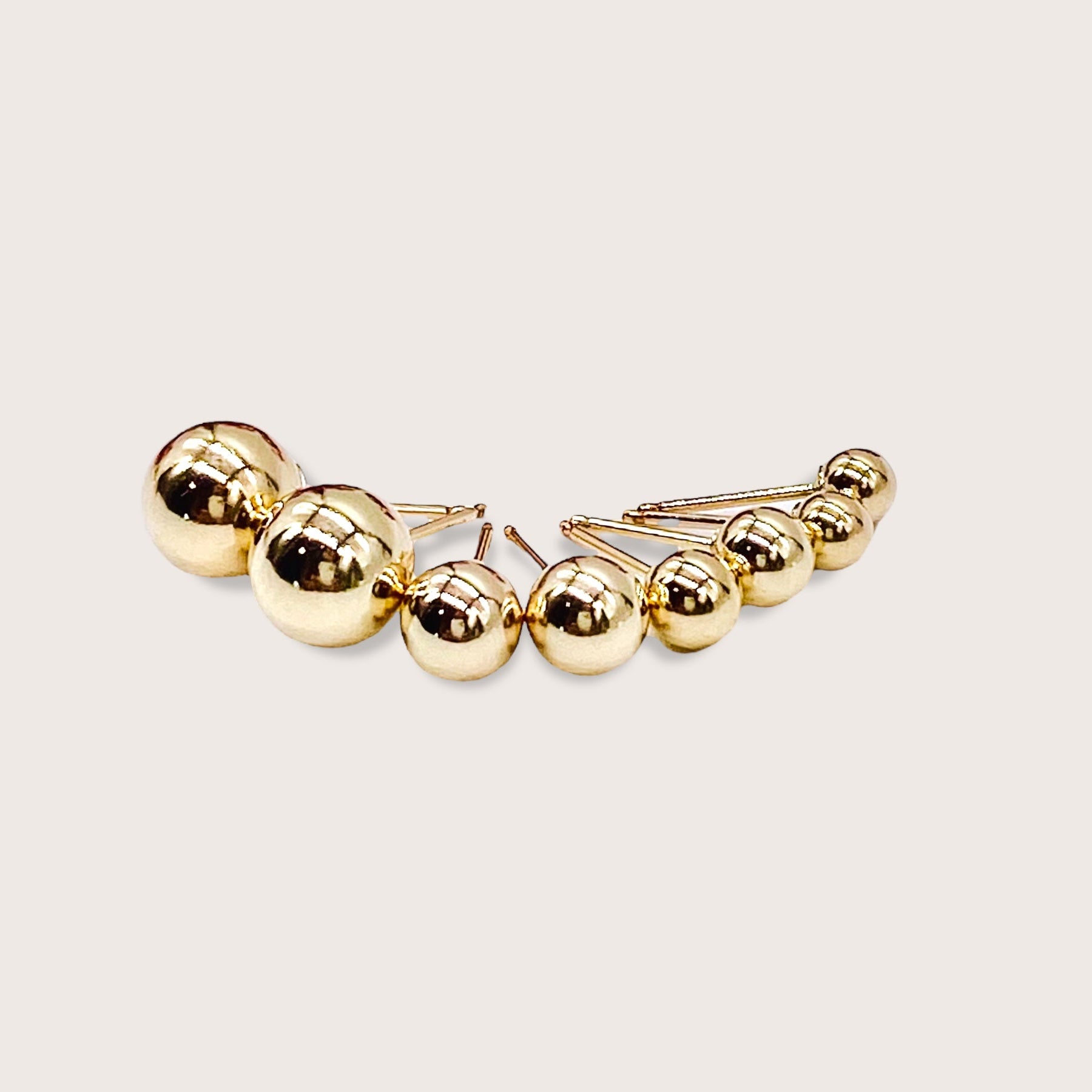The full size range of 14K gold-filled ball stud earrings from3mm to 8mm displayed in order on a clean white background.