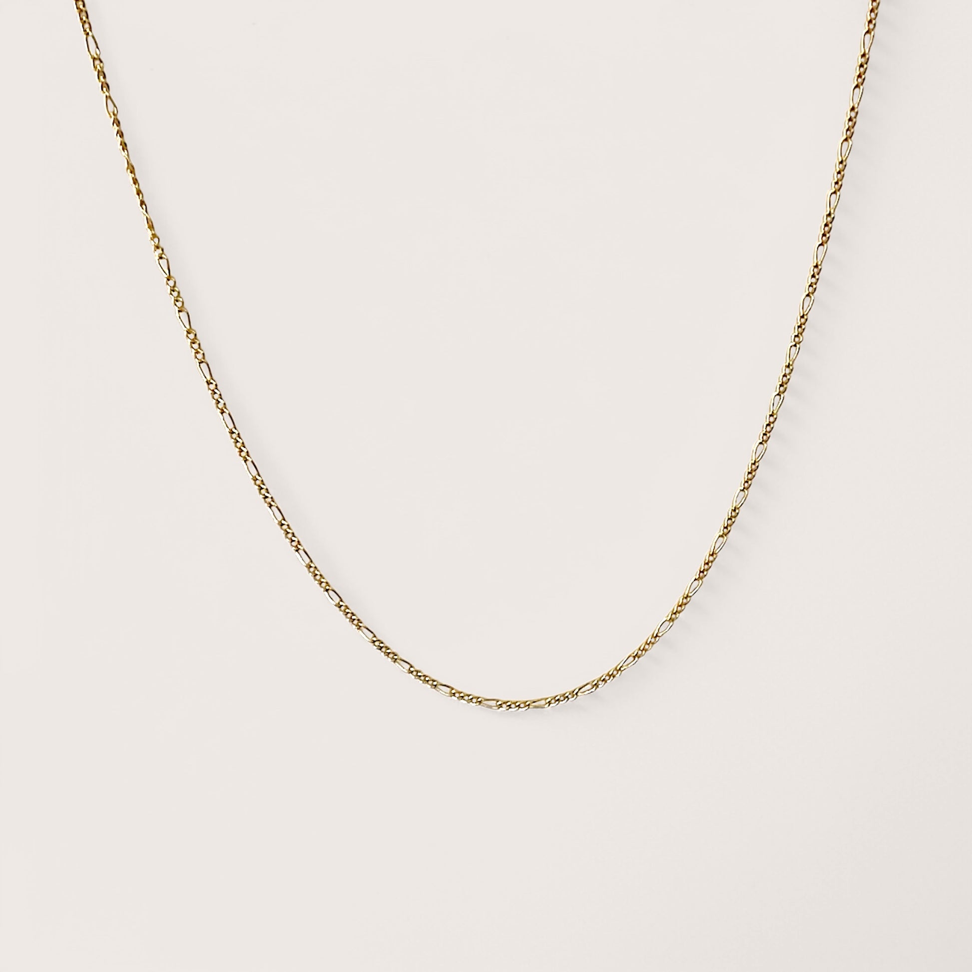 Dainty 14k yellow gold filled figaro necklaces.
