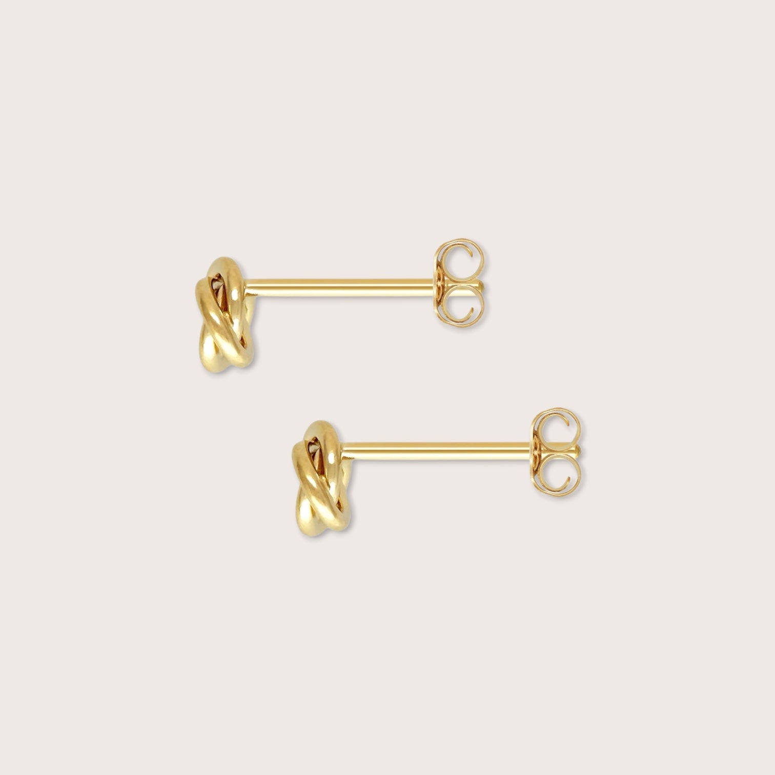 High polish 6mm interlocking knot earrings showing the hypoallergenic 14K gold filled for everyday wear.