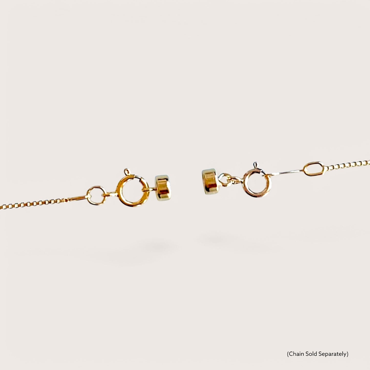 A close-up look at a 14K gold-filled magnetic clasp converter seamlessly blending into a fine gold necklace chain 