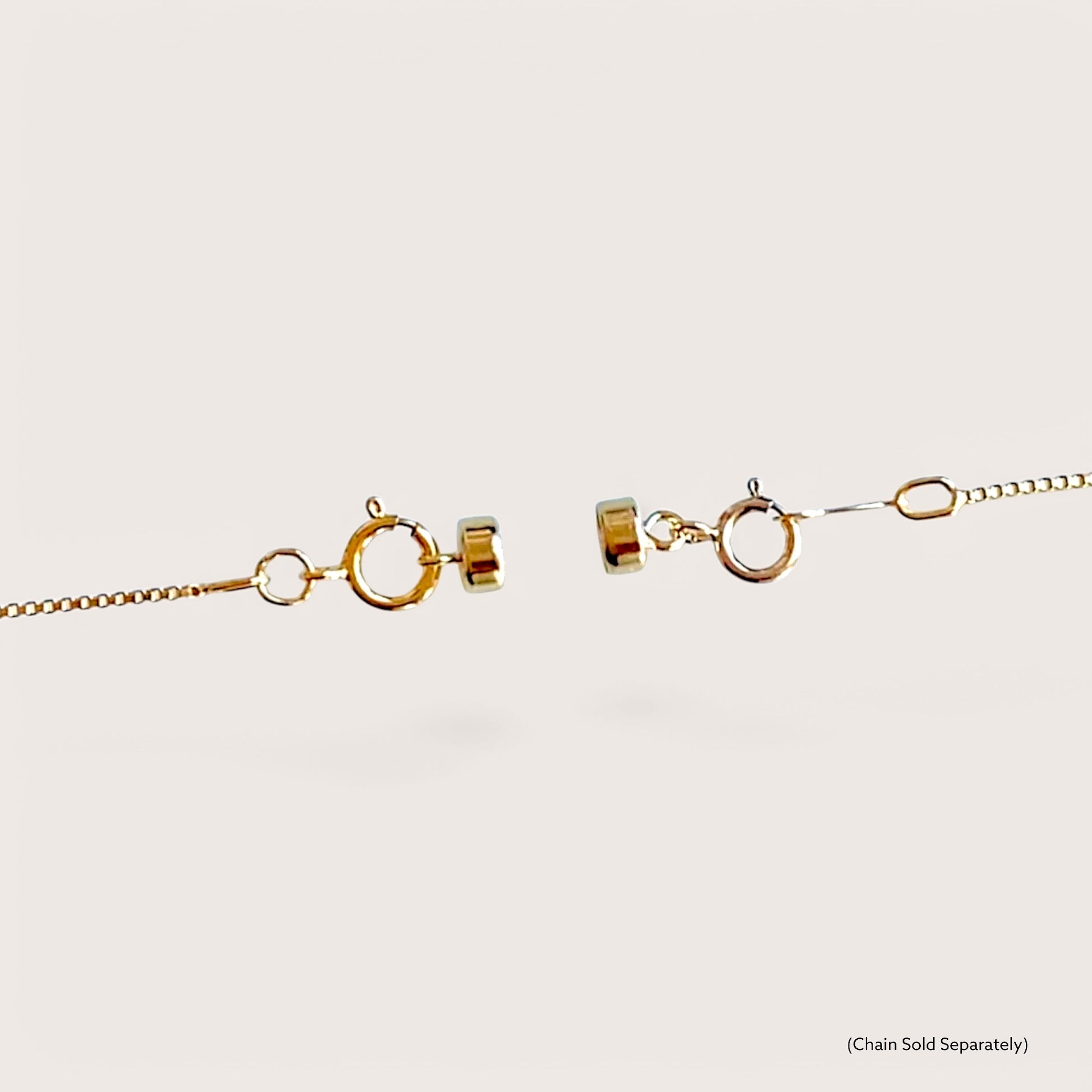 A close-up look at a 14K gold-filled magnetic clasp converter seamlessly blending into a fine gold necklace chain 